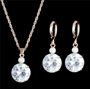 Gold crystal set earrings necklace